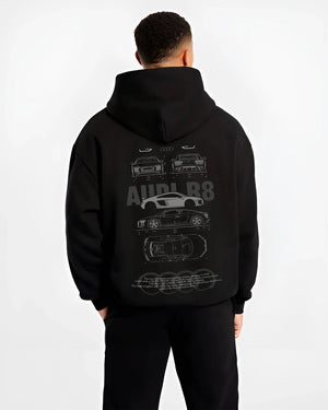 Black hoodie worn by a male model, back view, featuring Audi R8 v10 euro enthusiast racing street performance graphic.