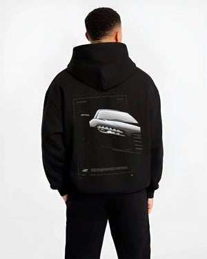 Black hoodie worn by a male model, back view, featuring Audi R8 turbo v10 racing german street performance graphic.