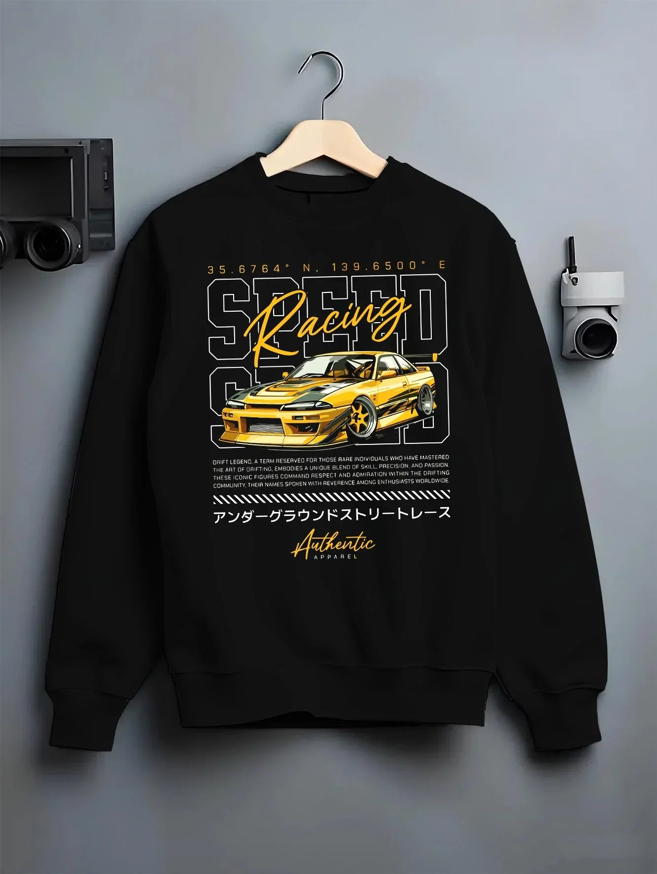 Black crewneck sweatshirt on a hanger against a grey wall, featuring SKYLINE racing drift japanese street legend speed graphic.