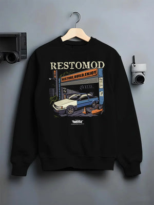 Black crewneck sweatshirt on a hanger against a grey wall, featuring Toyota AE86 drift jdm tuner street racing performance graphic.