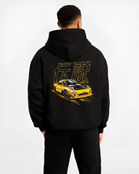 Black hoodie worn by a male model, back view, featuring Mazda RX-7 rx7 racing drift japanese tuner stance street legend graphic.