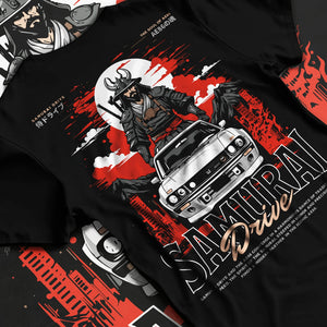 Black T-shirt laid flat with natural fabric folds, featuring drift japanese street racing performance motorsport automotive graphic.