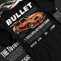 Black T-shirt laid flat with natural fabric folds, featuring Toyota Supra MK4 supra racing drift jdm tuner street legend graphic.