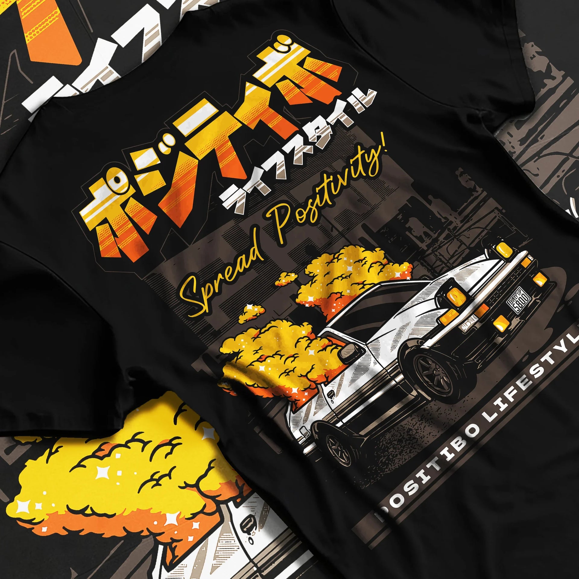 Black T-shirt laid flat with natural fabric folds, featuring Toyota AE86 drift jdm racing street performance motorsport graphic.