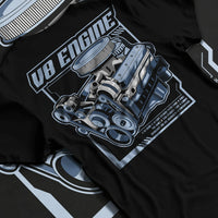 Black T-shirt laid flat with natural fabric folds, featuring rs v8 muscle street racing performance motorsport automotive graphic.